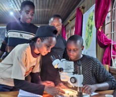 Nossim Ritte (front left) viewing sampled aquatic invertebrates